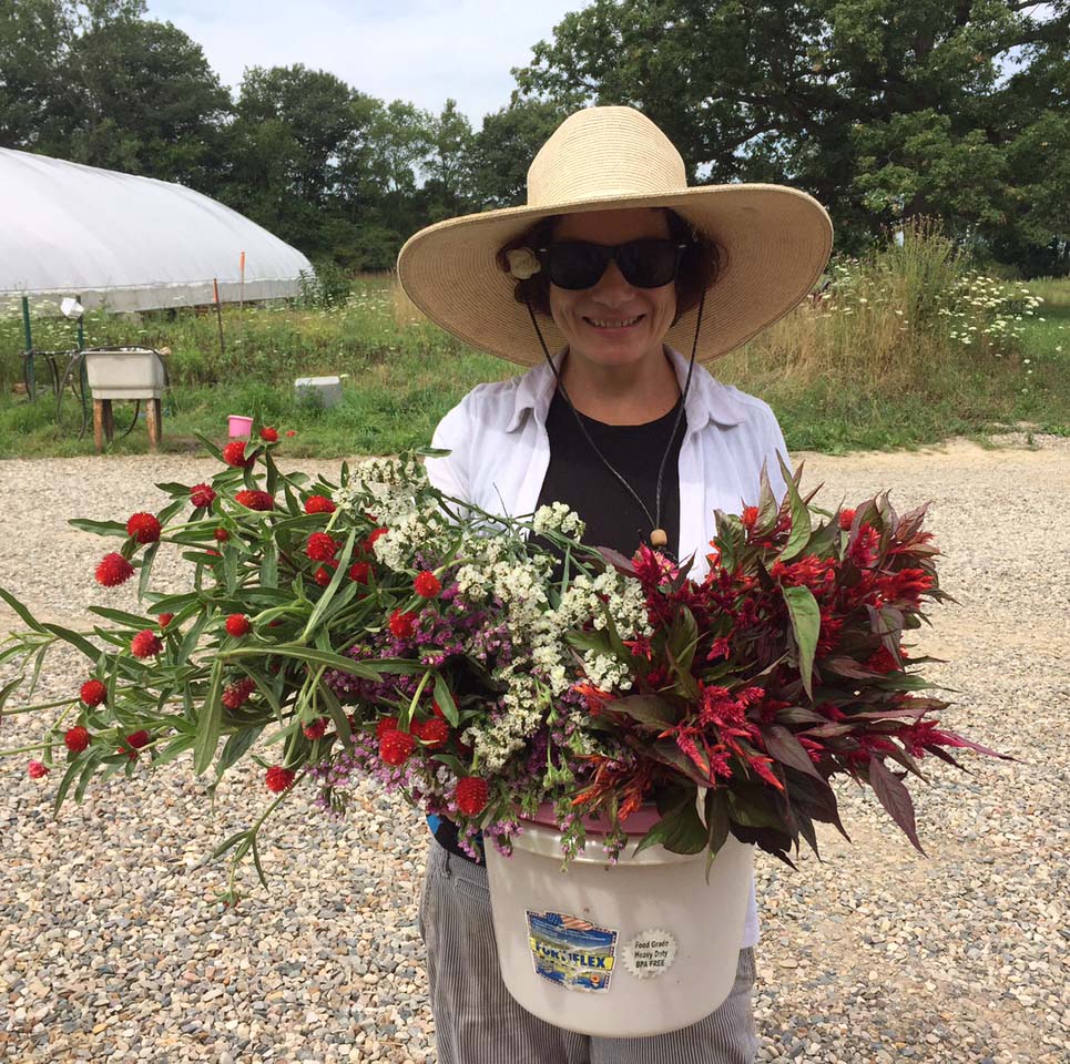 Trilby Becker picking flowers for bouquets she offers through a CSA.