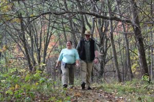 Two hikers walking on trail