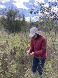 Anita Sandretto geocaching on a Legacy preserve