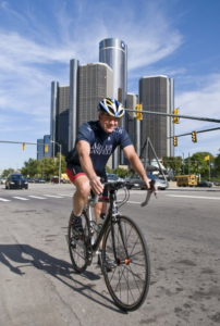 Steve Roach rides a bike in downtown Detroit