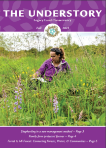 fall 2023 newsletter cover. Camryn sitting in a field.