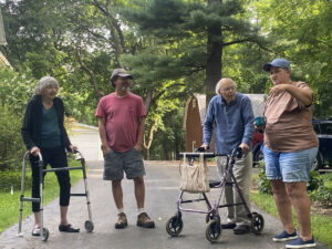 Beckwith Preserve 25th Anniversary Ice Cream Social. Fran, Drew, Campbell, and Diana stand in the driveway.