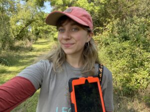 Cara Green, Easement Stewardship Associate, monitoring with her ipad on a property