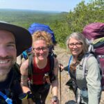 Krista (center) trekking the Porcupine Mountains this summer with her best friends, John and Mariah.