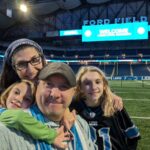 Pam, Tim, Jameson, and Finley at Ford Field.