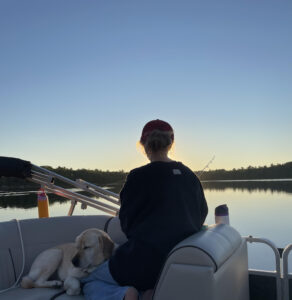 Cara and 'sis-fur' Rainy on a boat