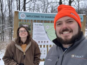Ari and Kyler are all smiles after installing the new kiosk signs.